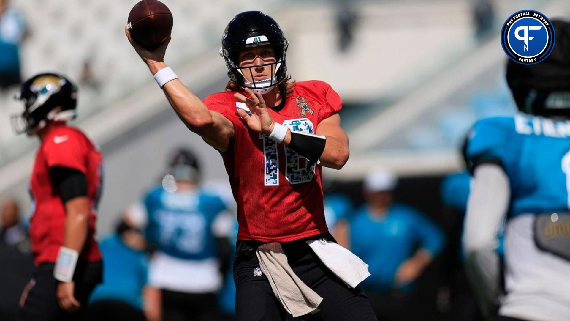 Jacksonville Jaguars quarterback Trevor Lawrence (16) passes the ball to running back Travis Etienne Jr. (1) during the ninth day of an NFL football training camp practice Saturday, Aug. 3, 2024 at EverBank Stadium in Jacksonville, Fla. Today marked the first day of public practice inside the stadium.