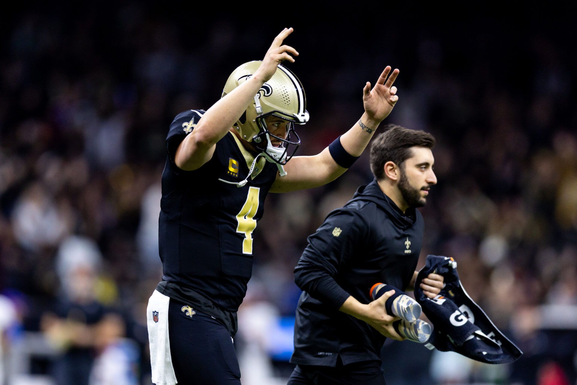 Jan 7, 2024; New Orleans, Louisiana, USA; New Orleans Saints quarterback Derek Carr (4) reacts to a touchdown against the Atlanta Falcons during the first half at Caesars Superdome. Mandatory Credit: Stephen Lew-USA TODAY Sports