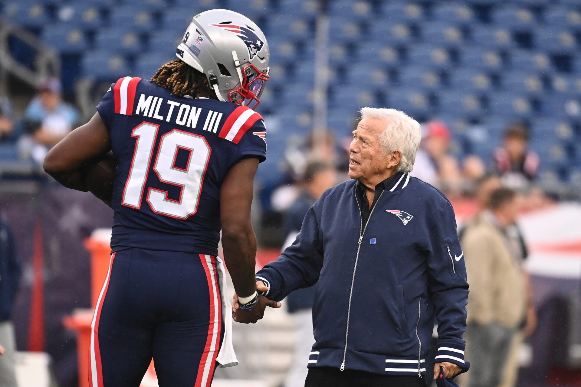 New England Patriots owner Robert Kraft talks to quarterback Joe Milton III (19) before a game against the Carolina Panthers at Gillette Stadium. Mandatory Credit: Eric Canha-USA TODAY Sports