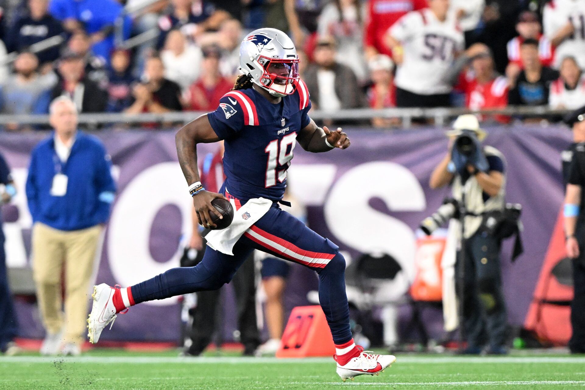 New England Patriots quarterback Joe Milton III (19) runs against against the Carolina Panthers during the second half at Gillette Stadium. Mandatory Credit: Brian Fluharty-USA TODAY Sports