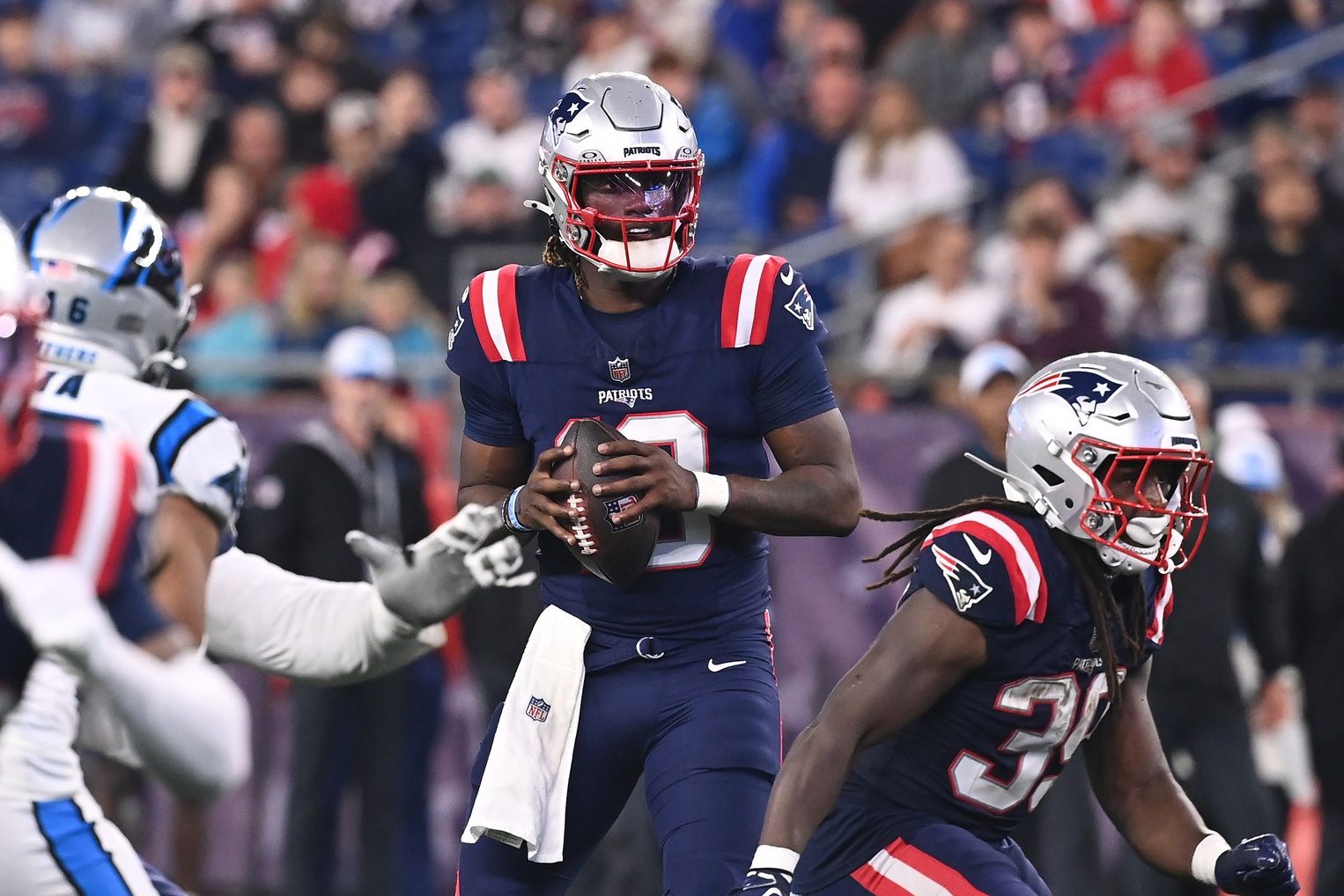 New England Patriots quarterback Joe Milton III (19) looks to throw a pass against the Carolina Panthers during the second half at Gillette Stadium. Mandatory Credit: Eric Canha-USA TODAY Sports