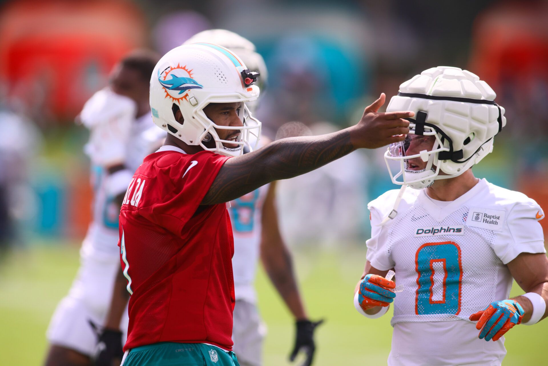 Jul 28, 2024; Miami Gardens, FL, USA; Miami Dolphins quarterback Tua Tagovailoa (1) signals during training camp at Baptist Health Training Complex. Mandatory Credit: Sam Navarro-USA TODAY Sports