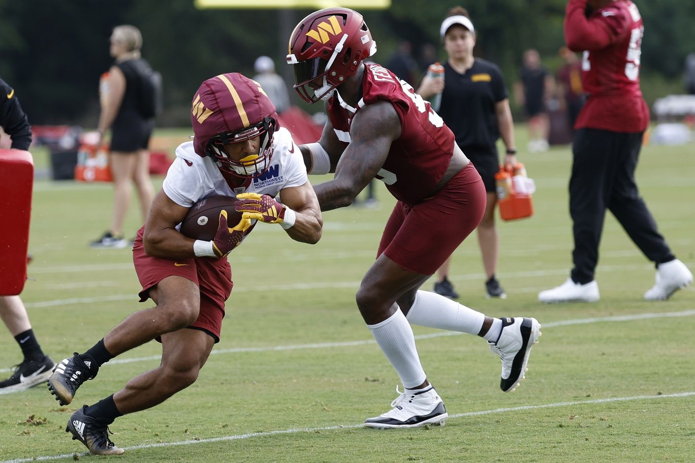 Washington Washington Commanders running back Austin Ekeler (30) carries the ball during day two of Commanders training camp at OrthoVirginia Training Center at Commanders Park. Mandatory Credit: Geoff Burke-USA TODAY Sports