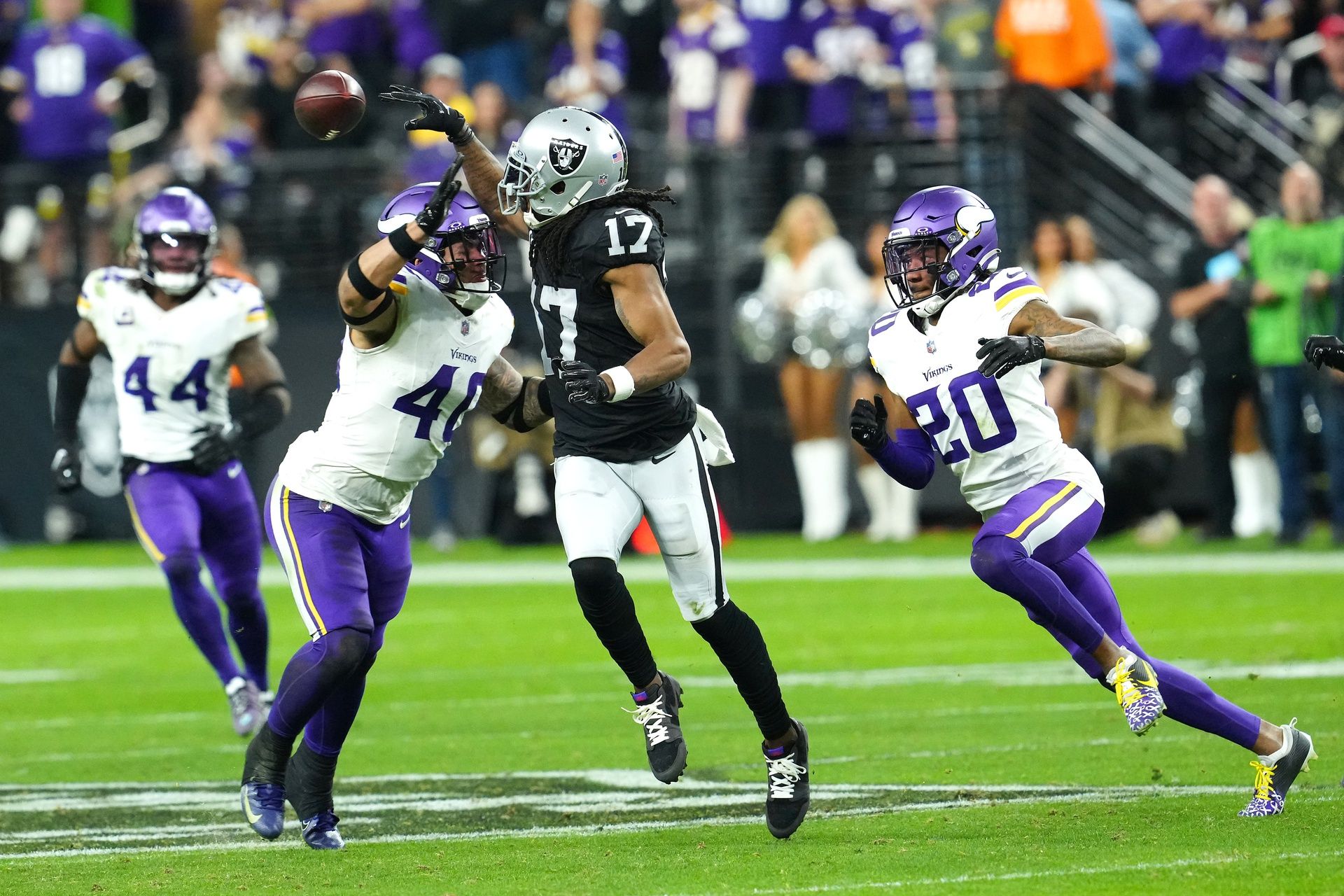 Las Vegas Raiders wide receiver Davante Adams (17) laterals the ball over Minnesota Vikings linebacker Ivan Pace Jr. (40) during the final seconds of the fourth quarter at Allegiant Stadium. Mandatory Credit: Stephen R. Sylvanie-USA TODAY Sports