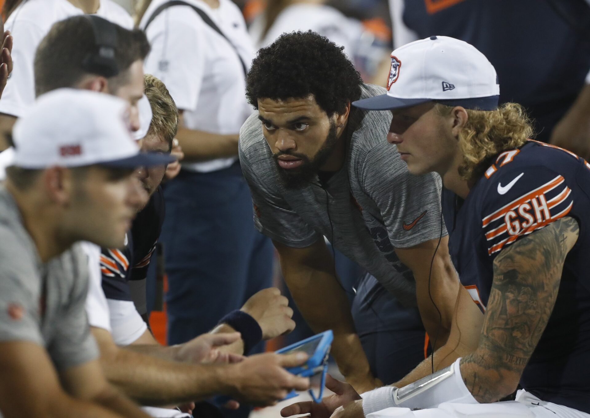 Chicago Bears quarterback Caleb Williams (RC) listens in the quarterback huddle on he sidelines against the Houston Texans during the third quarter at Tom Benson Hall of Fame Stadium. Mandatory Credit: Charles LeClaire-USA TODAY Sports