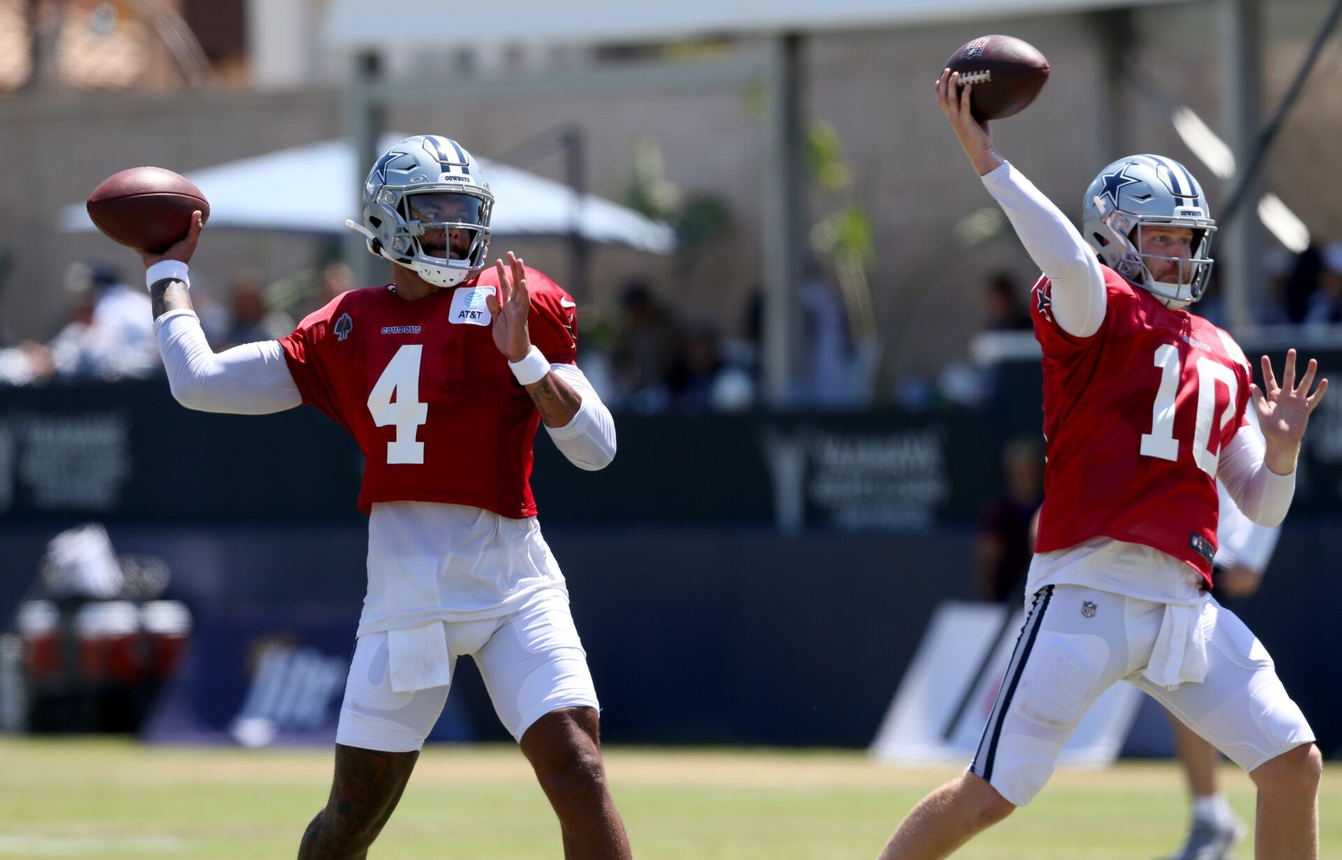 Jul 31, 2024; Oxnard, CA, USA; Dallas Cowboys quarterback Dak Prescott (4) throws next to quarterback Cooper Rush (10) during training camp at the River Ridge Playing Fields in Oxnard, California. Mandatory Credit: Jason Parkhurst-USA TODAY Sports