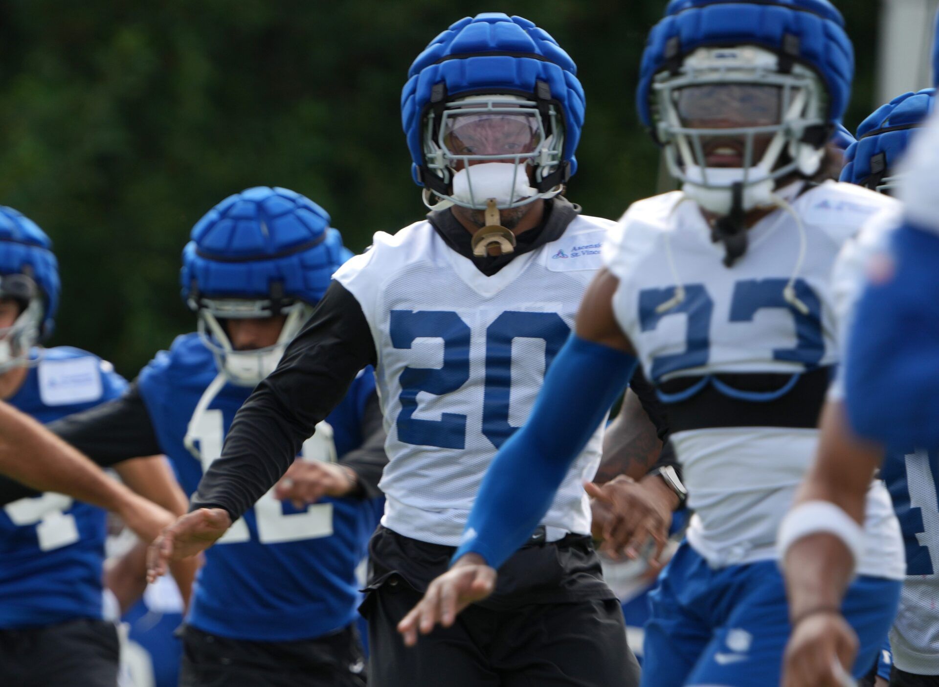 Indianapolis Colts safety Nick Cross (20) participates in warm ups during the Colts’ training camp on Friday, Aug. 9, 2024, at Grand Park Sports Complex in Westfield.