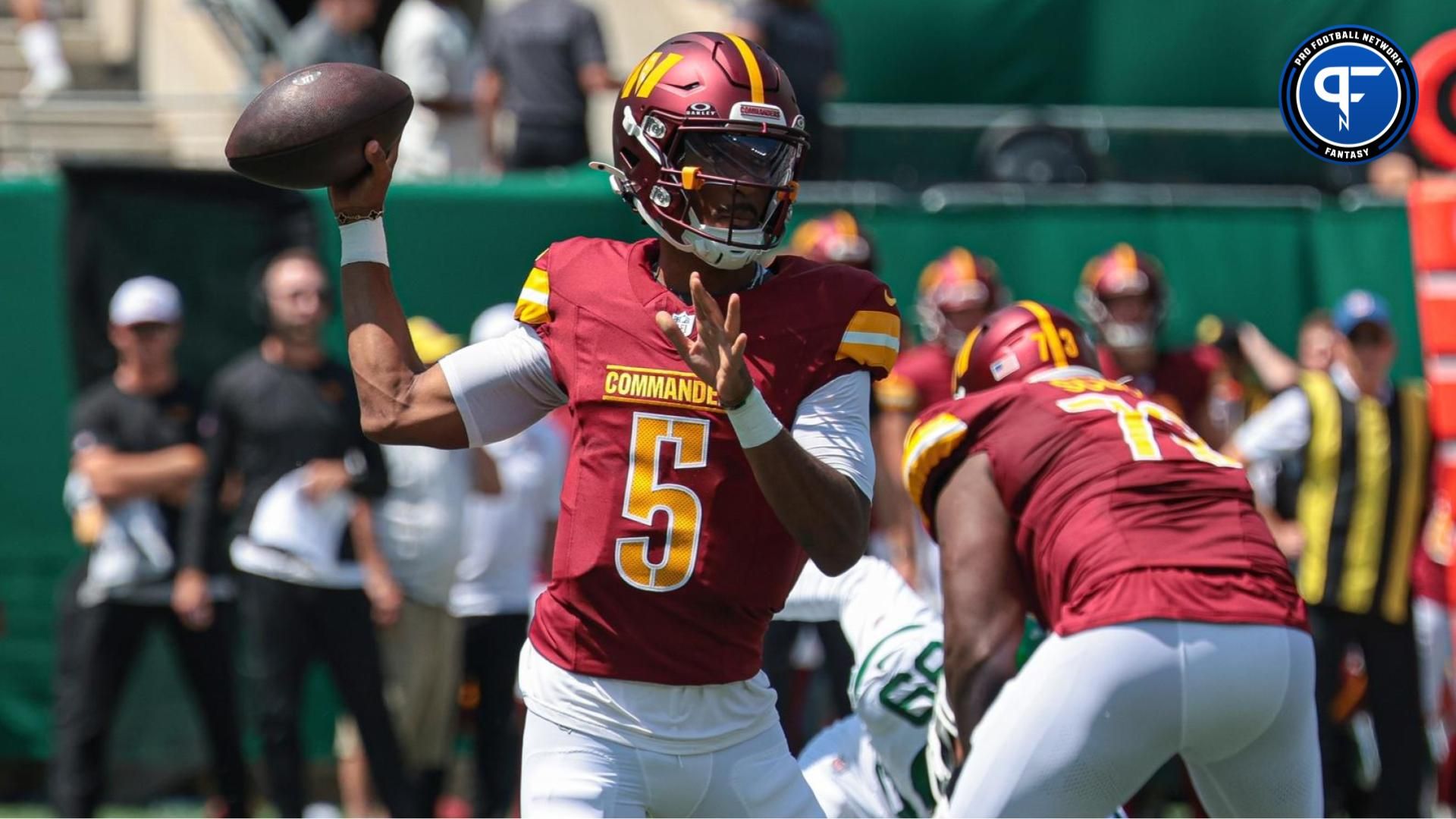 Washington Commanders quarterback Jayden Daniels (5) throws the ball during the first quarter against the New York Jets at MetLife Stadium. Daniels profiles to be a top fantasy football player in the NFC East in 2024. Mandatory Credit: Vincent Carchietta-USA TODAY Sports