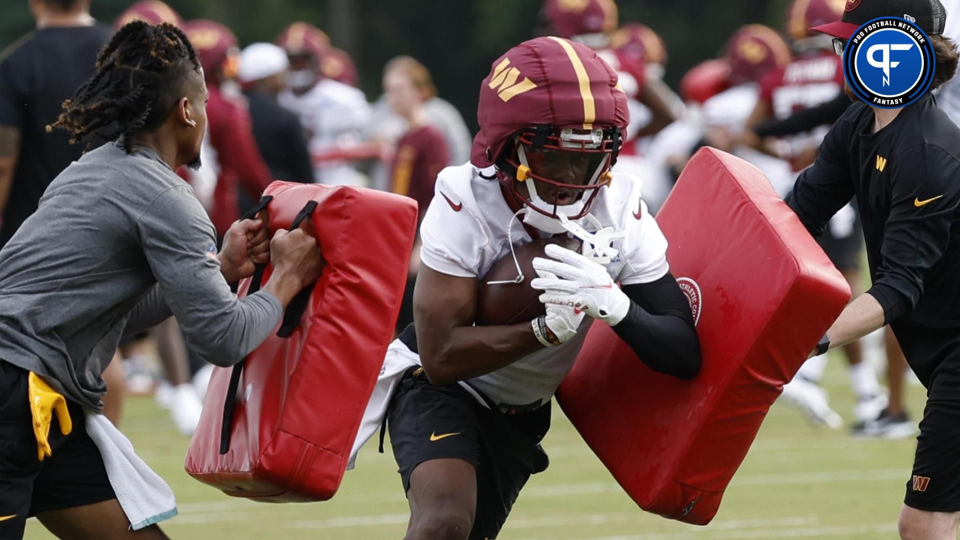 Jul 25, 2024; Ashburn, VA, USA; Washington Commanders wide receiver Jahan Dotson (1) carries the ball during day two of Commanders training camp at OrthoVirginia Training Center at Commanders Park. Mandatory Credit: Geoff Burke-USA TODAY Sports