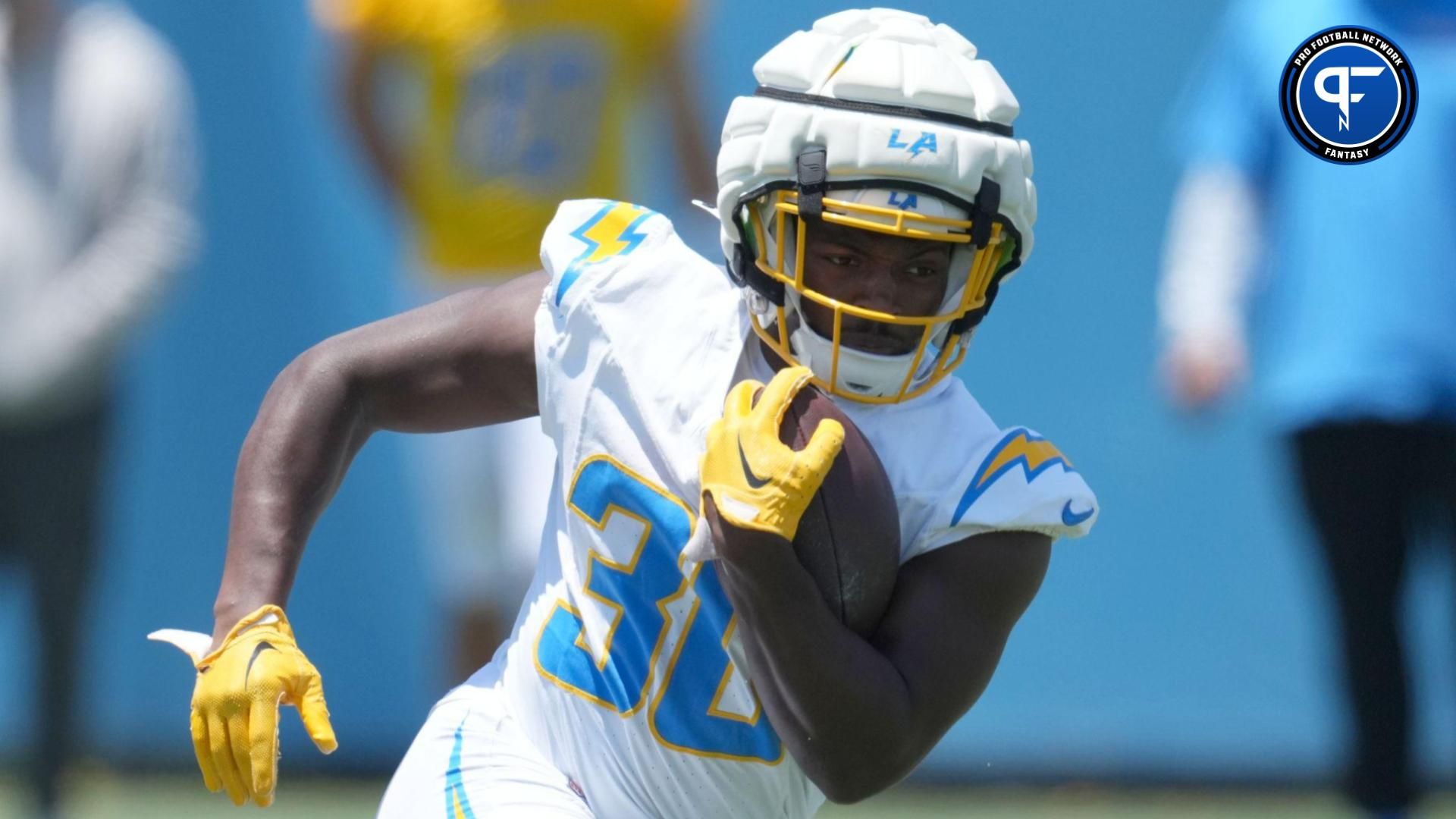 May 29, 2024; Costa Mesa, CA, USA; Los Angeles Chargers running back Kimani Vidal (30) wears a Guardian helmet cap during organized team activities at Hoag Performance Center. Mandatory Credit: Kirby Lee-USA TODAY Sports