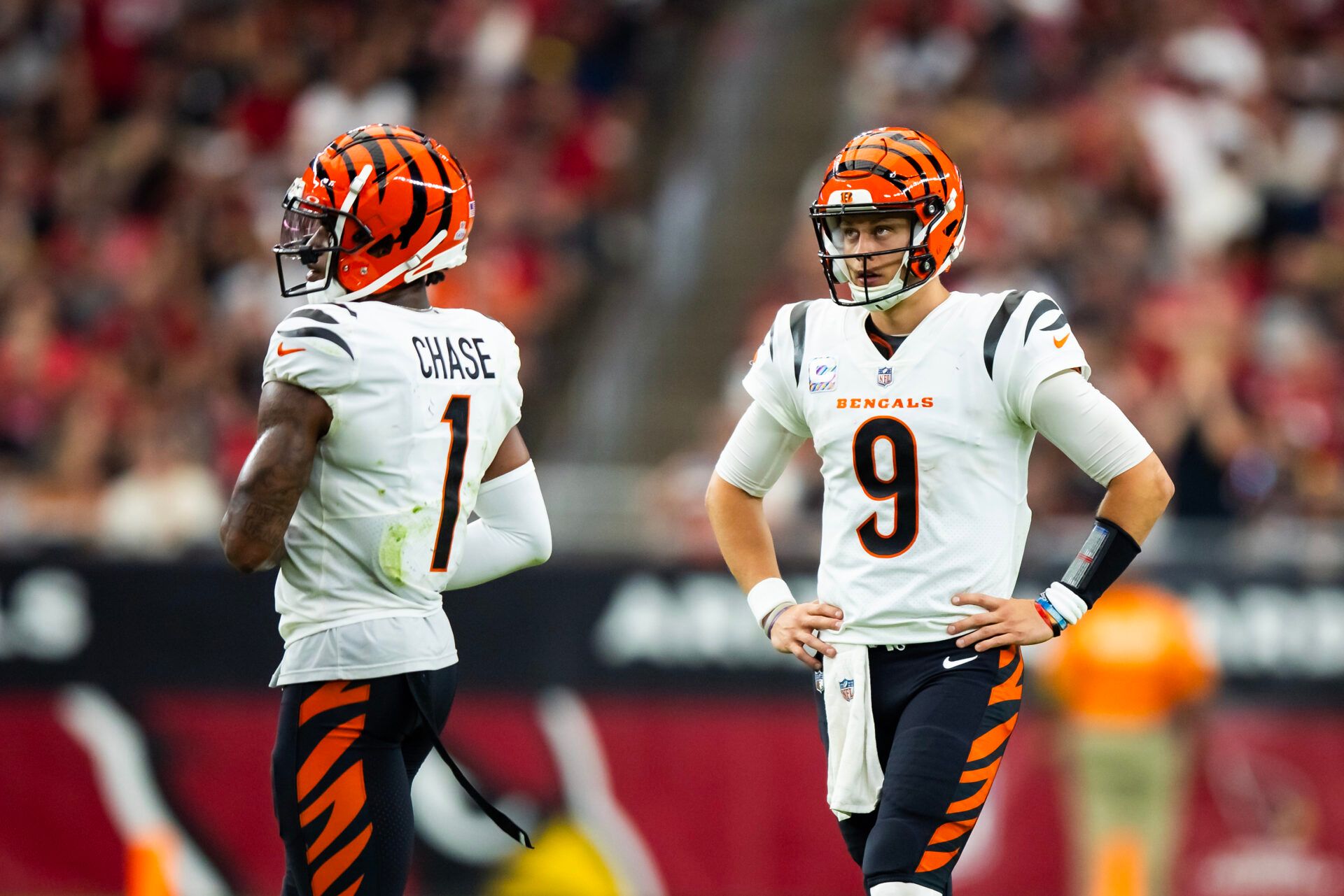 Oct 8, 2023; Glendale, Arizona, USA; Cincinnati Bengals quarterback Joe Burrow (9) and wide receiver Ja'Marr Chase (1) against the Arizona Cardinals in the second half at State Farm Stadium. Mandatory Credit: Mark J. Rebilas-USA TODAY Sports