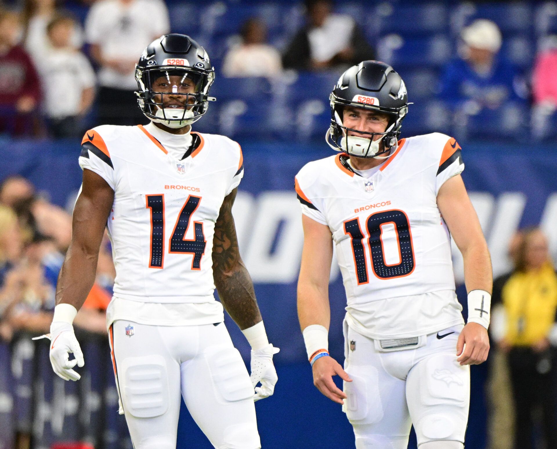 Aug 11, 2024; Indianapolis, Indiana, USA; Denver Broncos wide receiver Courtland Sutton (14) and quarterback Bo Nix (10) stand on the field during warm ups before the game against the Indianapolis Colts at Lucas Oil Stadium. Mandatory Credit: Marc Lebryk-USA TODAY Sports