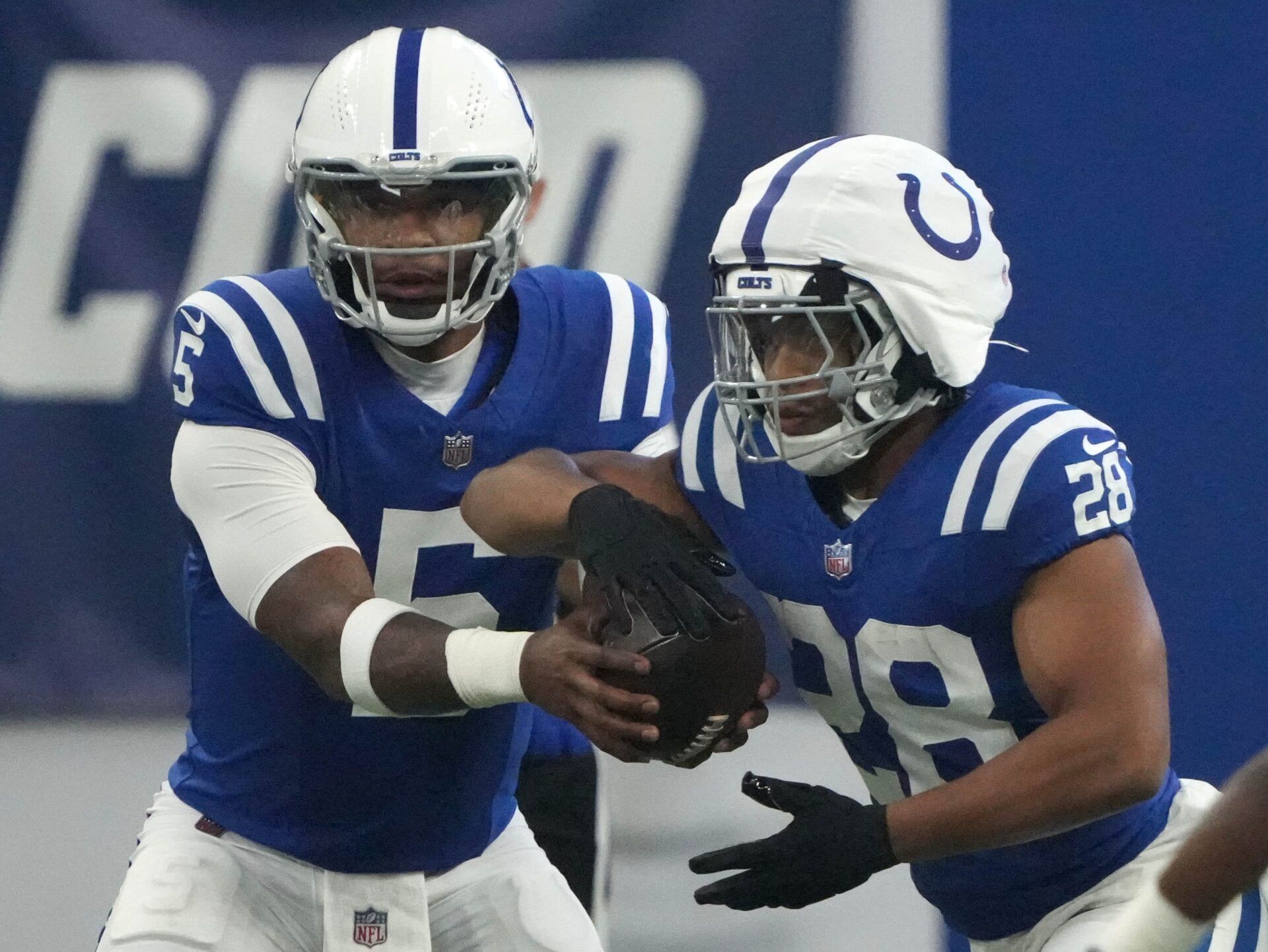 Indianapolis Colts quarterback Anthony Richardson (5) hands the ball off to running back Jonathan Taylor (28) during a preseason game Sunday, Aug. 11, 2024, at Lucas Oil Stadium in Indianapolis.