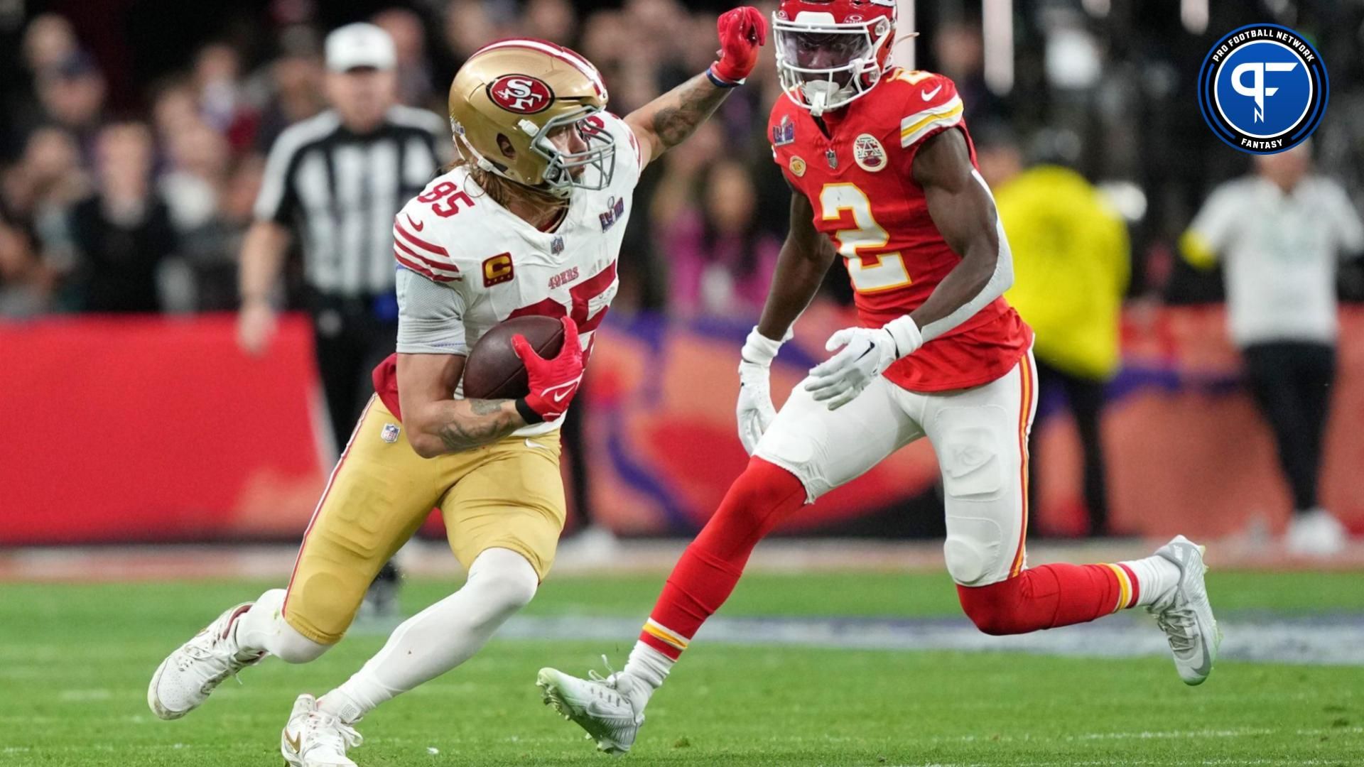 San Francisco 49ers tight end George Kittle (85) runs with the ball against the Kansas City Chiefs during the first quarter of Super Bowl LVIII at Allegiant Stadium.