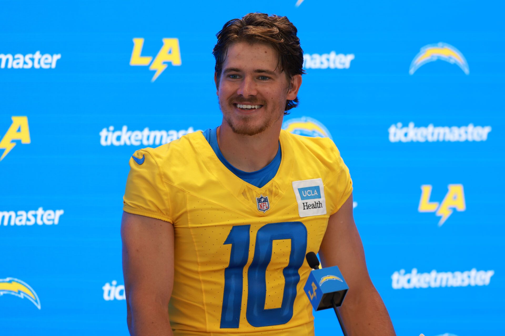 Jul 24, 2024; El Segundo, CA, USA; Los Angeles Chargers quarterback Justin Herbert (10) speaks to the media after the first day of training camp at The Bolt. Mandatory Credit: Kiyoshi Mio-USA TODAY Sports