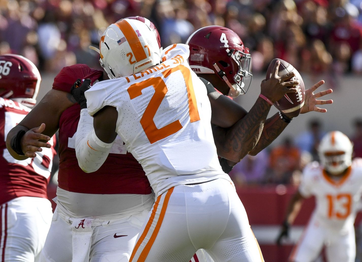 Tennessee Volunteers defensive lineman James Pearce Jr. (27) causes a fumble by Alabama Crimson Tide quarterback Jalen Milroe (4) which Tennessee recovered at Bryant-Denny Stadium. Mandatory Credit: Gary Cosby Jr.-USA TODAY Sports