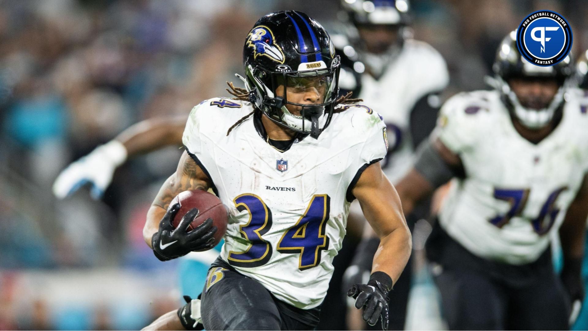 Baltimore Ravens running back Keaton Mitchell (34) runs the ball against the Jacksonville Jaguars in the fourth quarter at EverBank Stadium. Mandatory Credit: Jeremy Reper-USA TODAY Sports