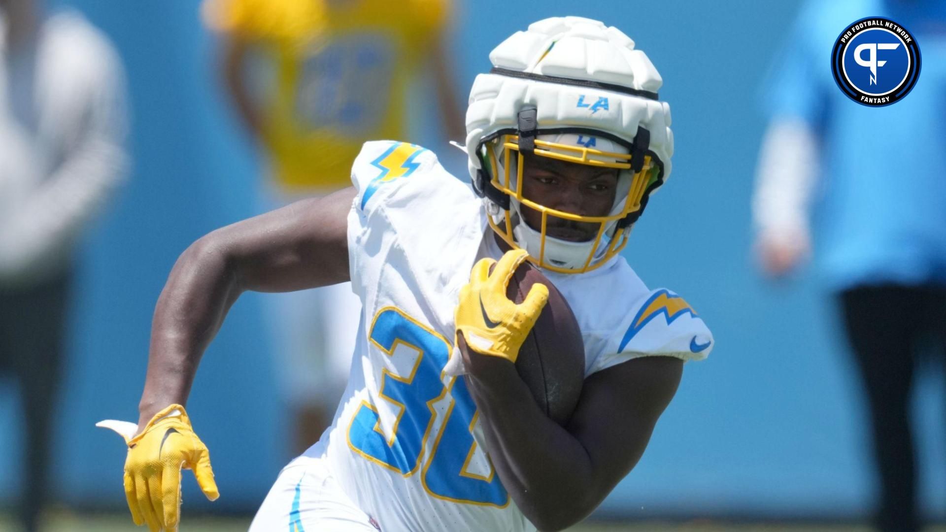 Los Angeles Chargers running back Kimani Vidal (30) wears a Guardian helmet cap during organized team activities at Hoag Performance Center. Mandatory Credit: Kirby Lee-USA TODAY Sports