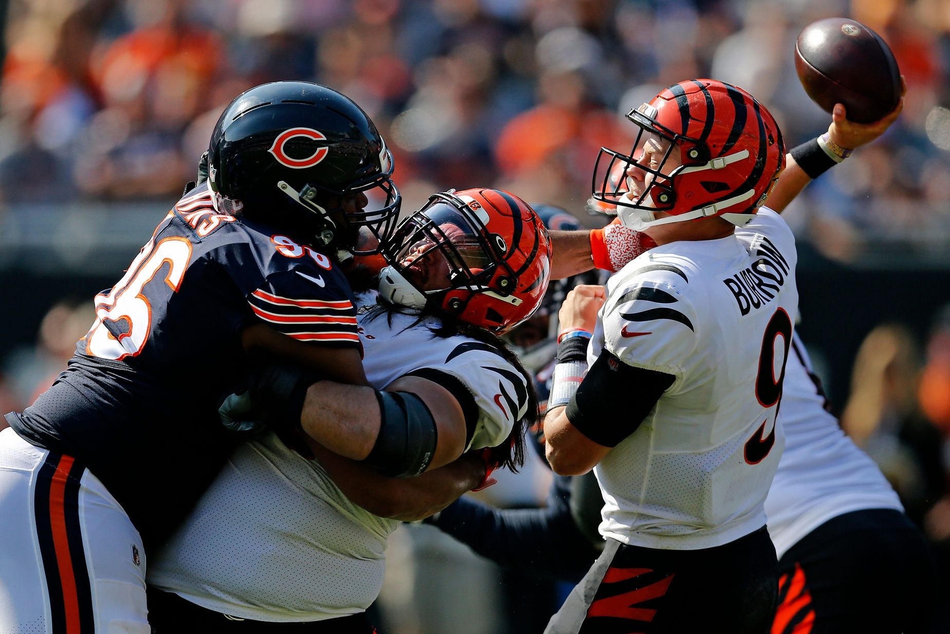 Chicago Bears defensive end Akiem Hicks (96) gets a hand on Cincinnati Bengals quarterback Joe Burrow (9) as he attempts to throw with failed protection from center Trey Hopkins (66) in the fourth quarter of the NFL Week 2 game between the Chicago Bears and the Cincinnati Bengals at Soldier Field in Chicago on Sunday, Sept. 19, 2021. The Bears held on to a halftime lead for a 20-17 win over the Bengals.