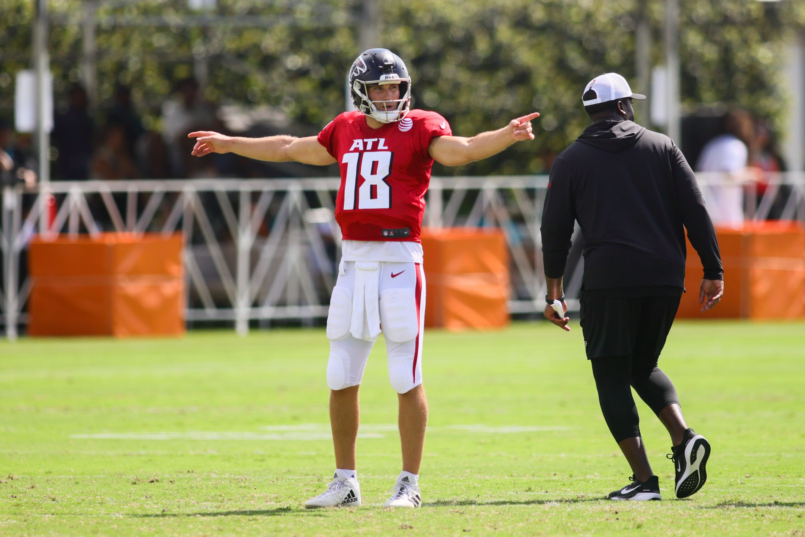 Aug 6, 2024; Miami Gardens, FL, USA; Atlanta Falcons quarterback Kirk Cousins (18) signals during a joint practice with the Miami Dolphins at Baptist Health Training Complex. Mandatory Credit: Sam Navarro-USA TODAY Sports