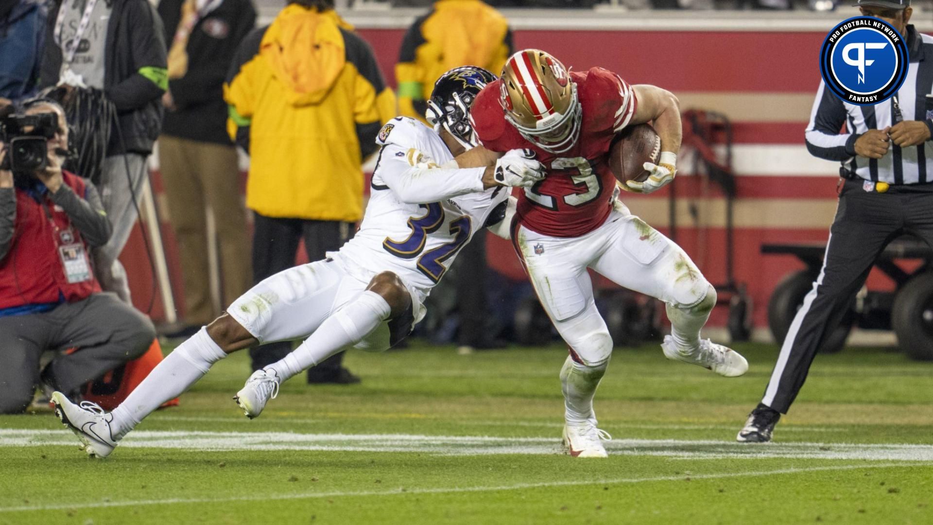 San Francisco 49ers running back Christian McCaffrey (23) rushes with the football against Baltimore Ravens safety Marcus Williams (32) during the second quarter at Levi's Stadium. Should he be the third pick in your fantasy football draft?