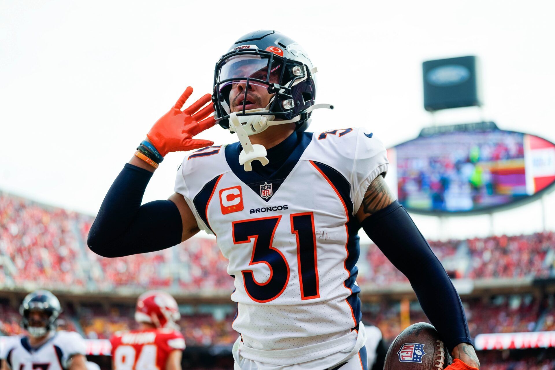 Denver Broncos safety Justin Simmons (31) celebrates after an interception during the first half against the Kansas City Chiefs at GEHA Field at Arrowhead Stadium. Mandatory Credit: Jay Biggerstaff-USA TODAY Sports