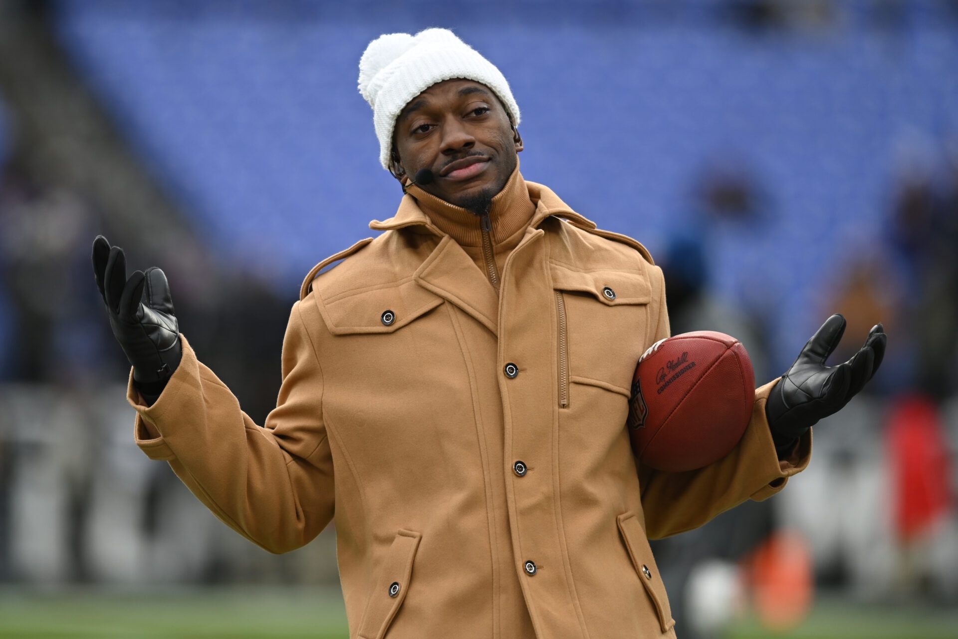 Jan 20, 2024; Baltimore, MD, USA; ESPN college football and NFL analyst Robert Griffin III reacts on the sidelines before a 2024 AFC divisional round game between the Houston Texans and the Baltimore Ravens at M&T Bank Stadium. Mandatory Credit: Tommy Gilligan-USA TODAY Sports