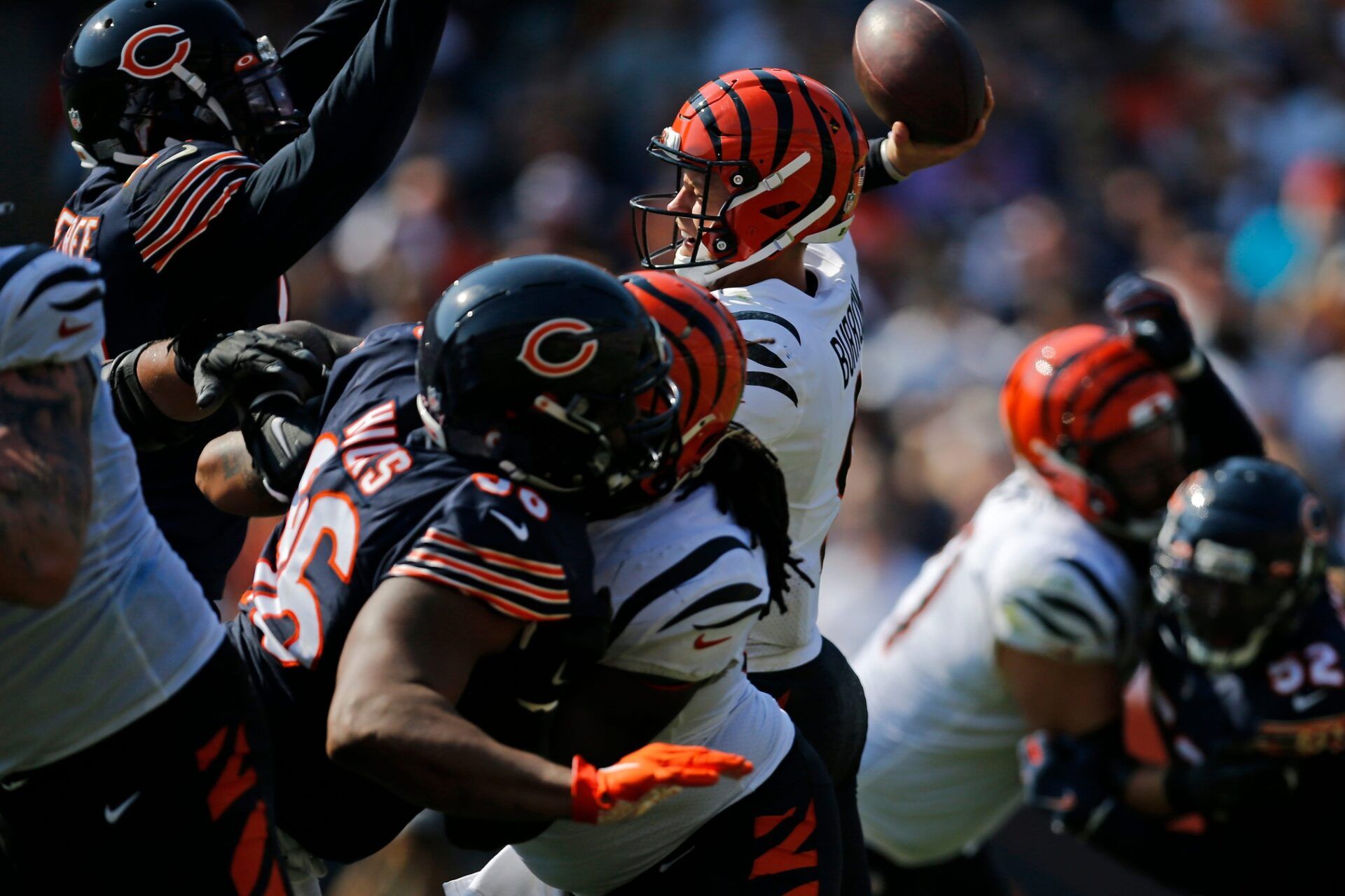 Cincinnati Bengals quarterback Joe Burrow (9) attempts to throw as the pocket collapses around him, resulting in a third-in-a-row interception in the fourth quarter of the NFL Week 2 game between the Chicago Bears and the Cincinnati Bengals at Soldier Field in Chicago on Sunday, Sept. 19, 2021. The Bears held on to a halftime lead for a 20-17 win over the Bengals. Cincinnati Bengals At Chicago Bears