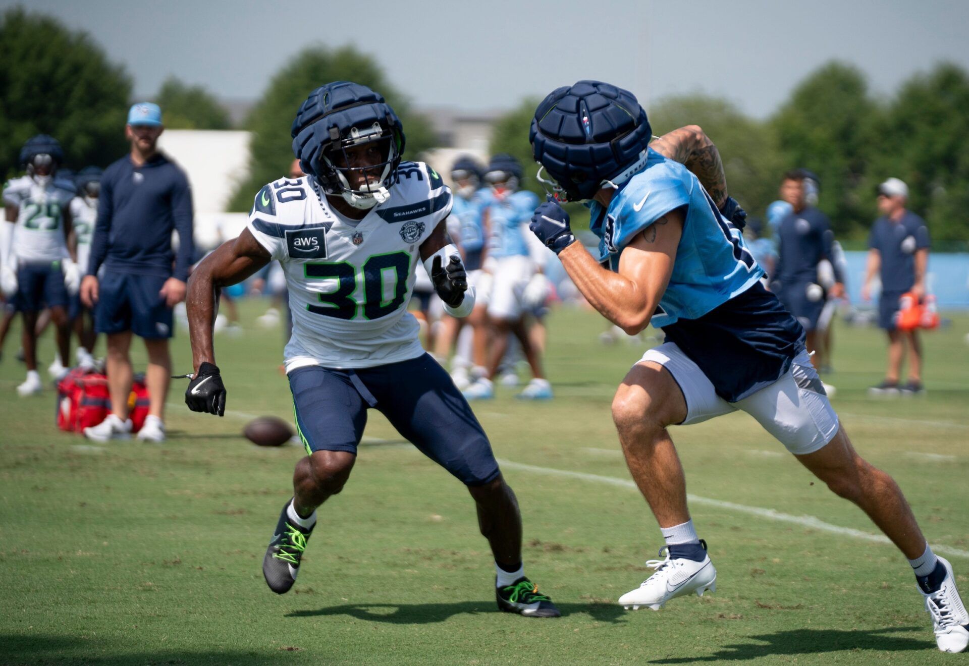 Seattle Seahawks cornerback Michael Jackson (30) guards Tennessee Titans wide receiver Mason Kinsey (12) at Ascension Saint Thomas Sports Park in Nashville, Tenn., Thursday, Aug. 15, 2024. This is the second day of the Titans joint practice with the Seattle Seahawks.