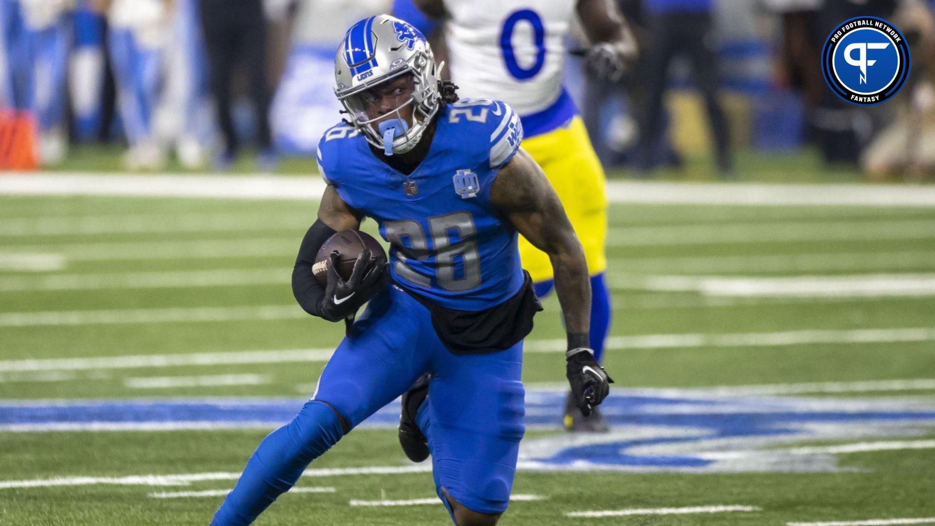 Detroit Lions running back Jahmyr Gibbs (26) runs during the first half of a 2024 NFC wild card game against the Los Angeles Rams at Ford Field. Mandatory Credit: David Reginek-USA TODAY Sports