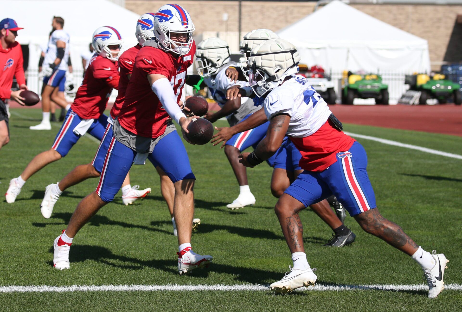 Bills quarterback Josh Allen hands off to running back Ray Davis during drills during the Buffalo Bills training camp Wednesday, Aug. 7, 2024 at St. John Fisher University. © Shawn Dowd/Rochester Democrat and Chronicle / USA TODAY NETWORK