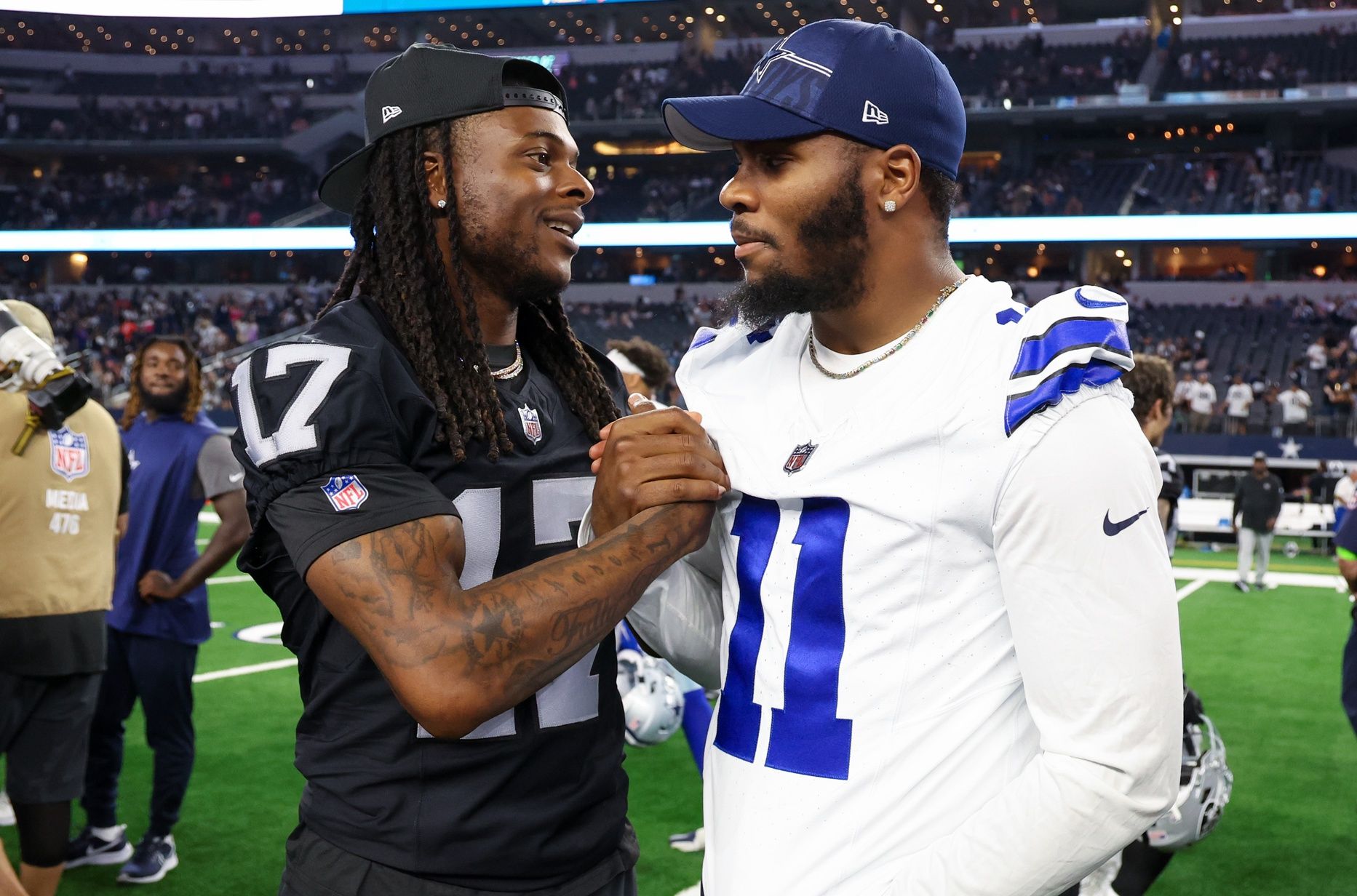 Las Vegas Raiders wide receiver Davante Adams (17) greets Dallas Cowboys linebacker Micah Parsons (11) after the game at AT&T Stadium. Mandatory Credit: Kevin Jairaj-USA TODAY Sports