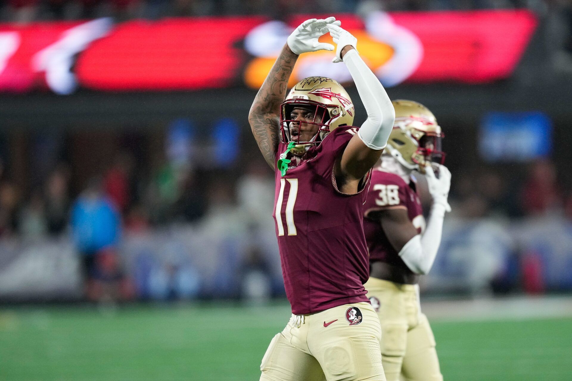 Florida State Seminoles defensive lineman Patrick Payton (11) reacts during the fourth quarter against the Louisville Cardinals at Bank of America Stadium. Mandatory Credit: Jim Dedmon-USA TODAY Sports