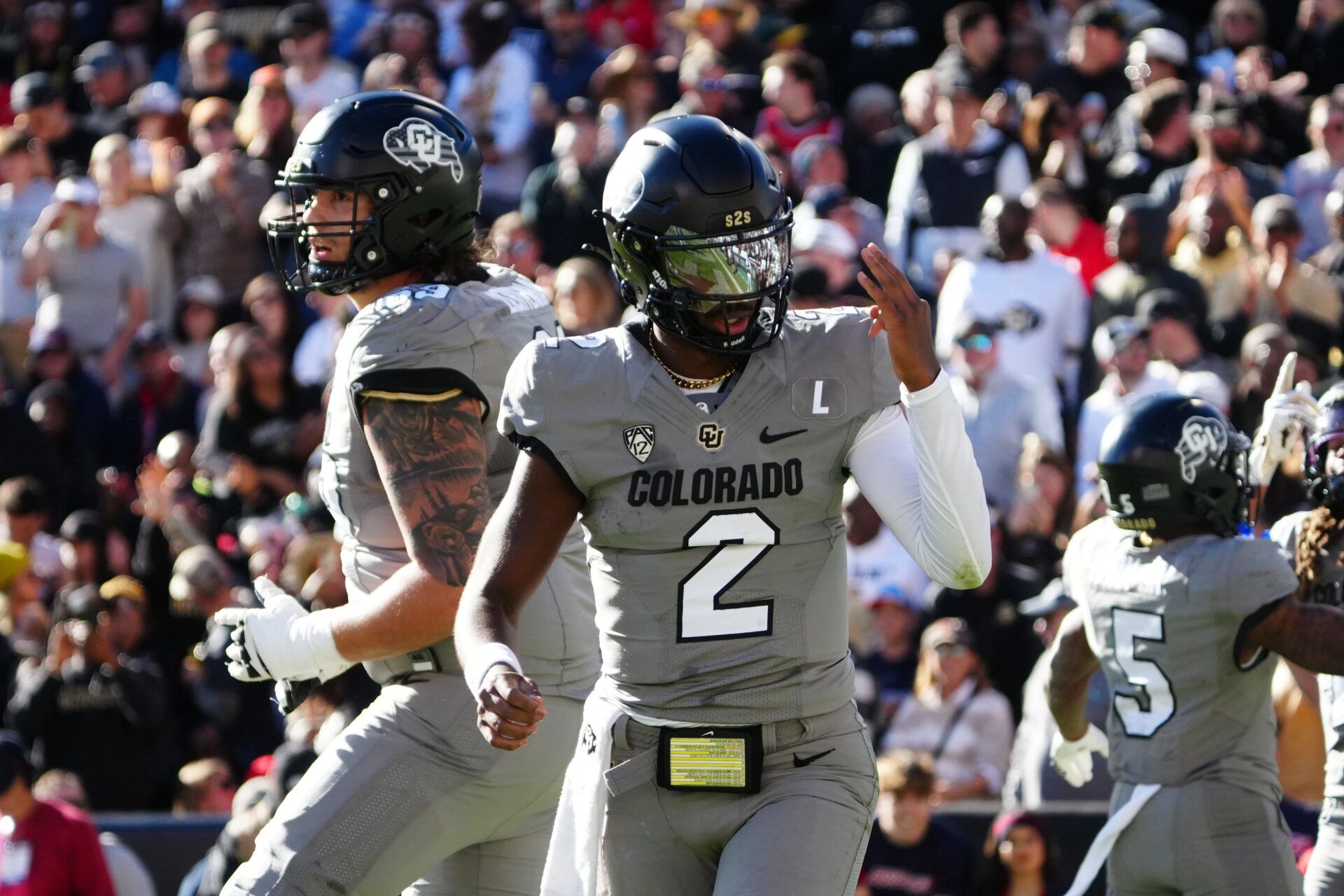 Colorado Buffaloes quarterback Shedeur Sanders (2) celebrates after a touchdown against the Arizona Wildcats in the second quarter at Folsom Field. Mandatory Credit: Ron Chenoy-USA TODAY Sports