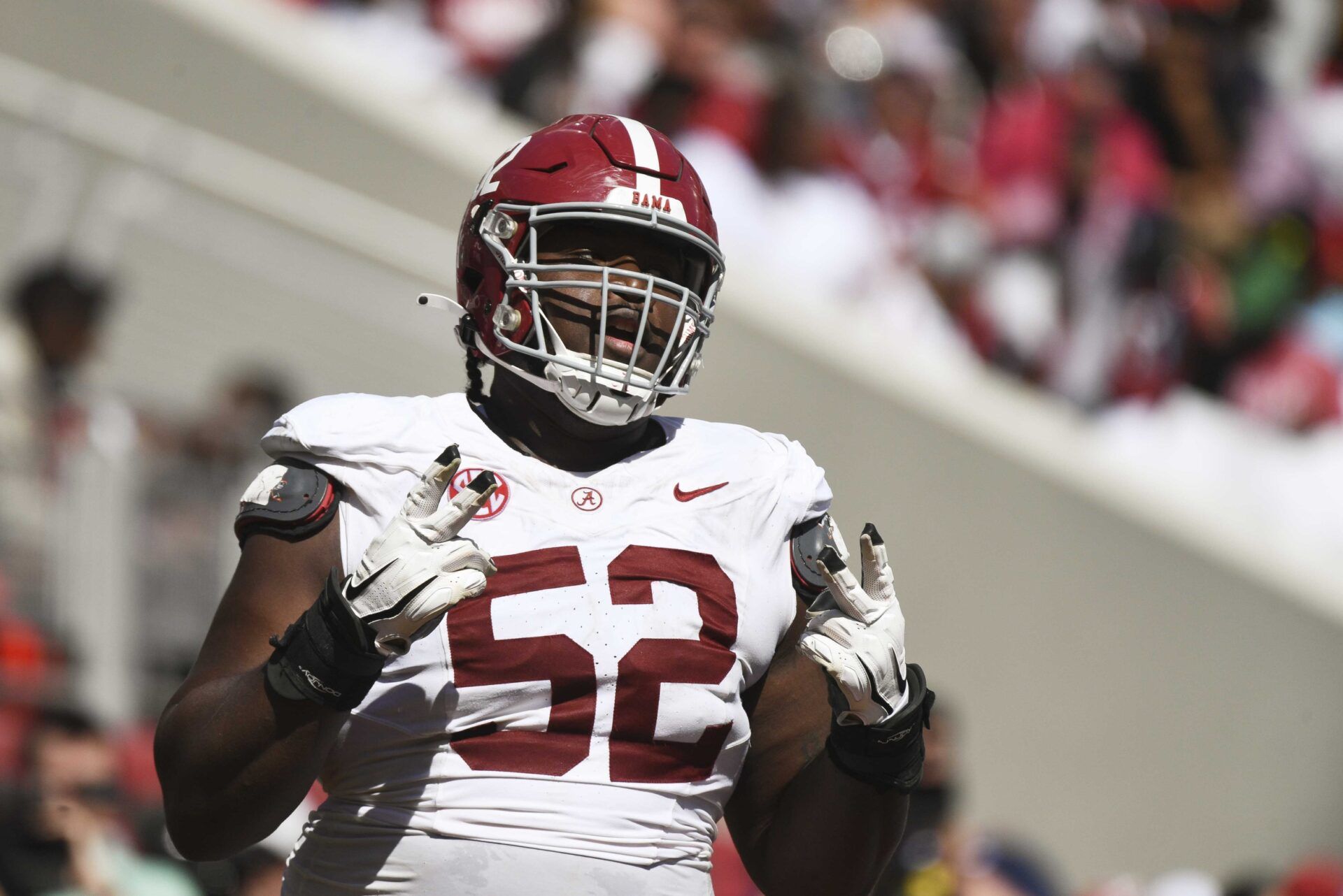 Alabama offensive lineman Tyler Booker (52) celebrates after the offense scored a touchdown during the A-Day scrimmage at Bryant-Denny Stadium. Mandatory Credit: Gary Cosby Jr.-USA TODAY Sports