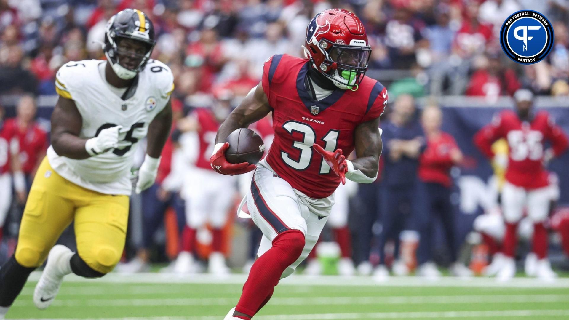 Houston Texans running back Dameon Pierce (31) runs with the ball during the first quarter against the Pittsburgh Steelers at NRG Stadium. Mandatory Credit: Troy Taormina-USA TODAY Sports