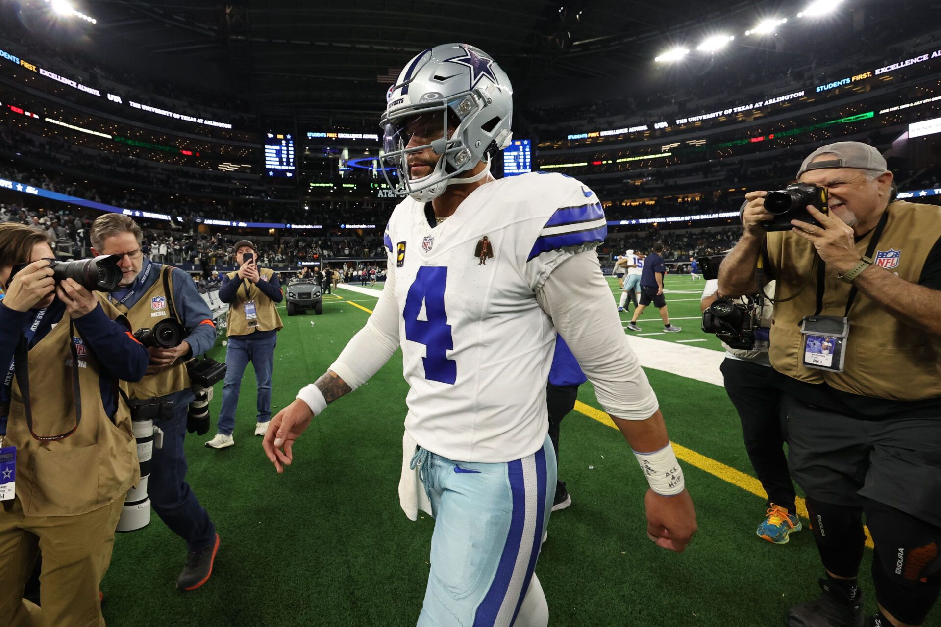 Jan 14, 2024; Arlington, Texas, USA; Dallas Cowboys quarterback Dak Prescott (4) walks off the field against the Green Bay Packers after the 2024 NFC wild card game at AT&T Stadium. Mandatory Credit: Kevin Jairaj-USA TODAY Sports