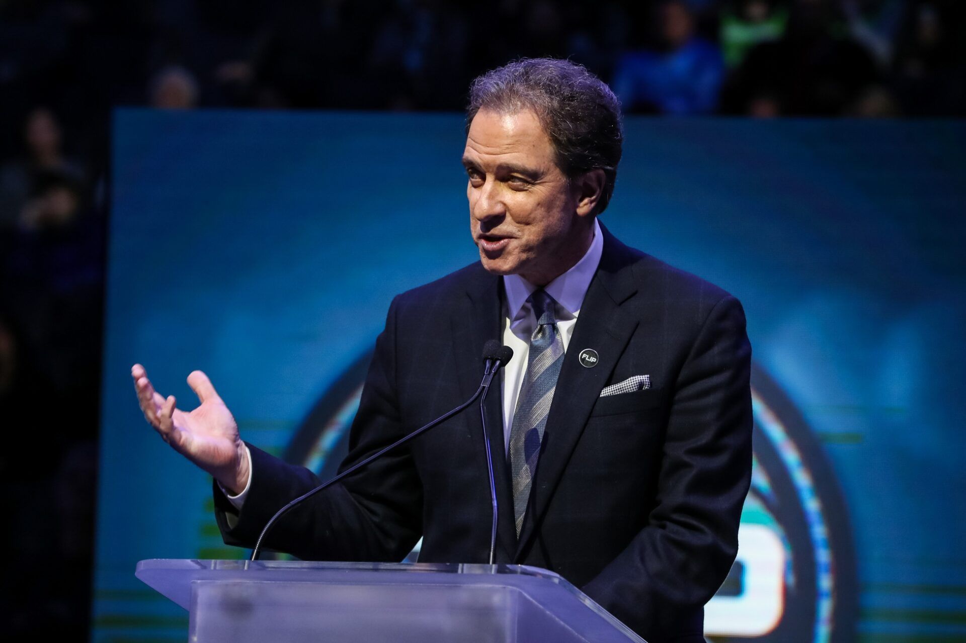 TNT television personality Kevin Harlan speaks during a ceremony honoring former Minnesota Timberwolves head coach Flip Saunders prior to a game against Los Angeles Lakers at Target Center. Mandatory Credit: Brace Hemmelgarn-USA TODAY Sports