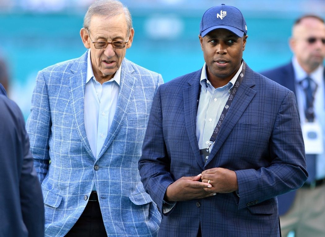 Dolphins owner Stephen Ross (left) talks with general manager Chris Grier before a game in November 2022.