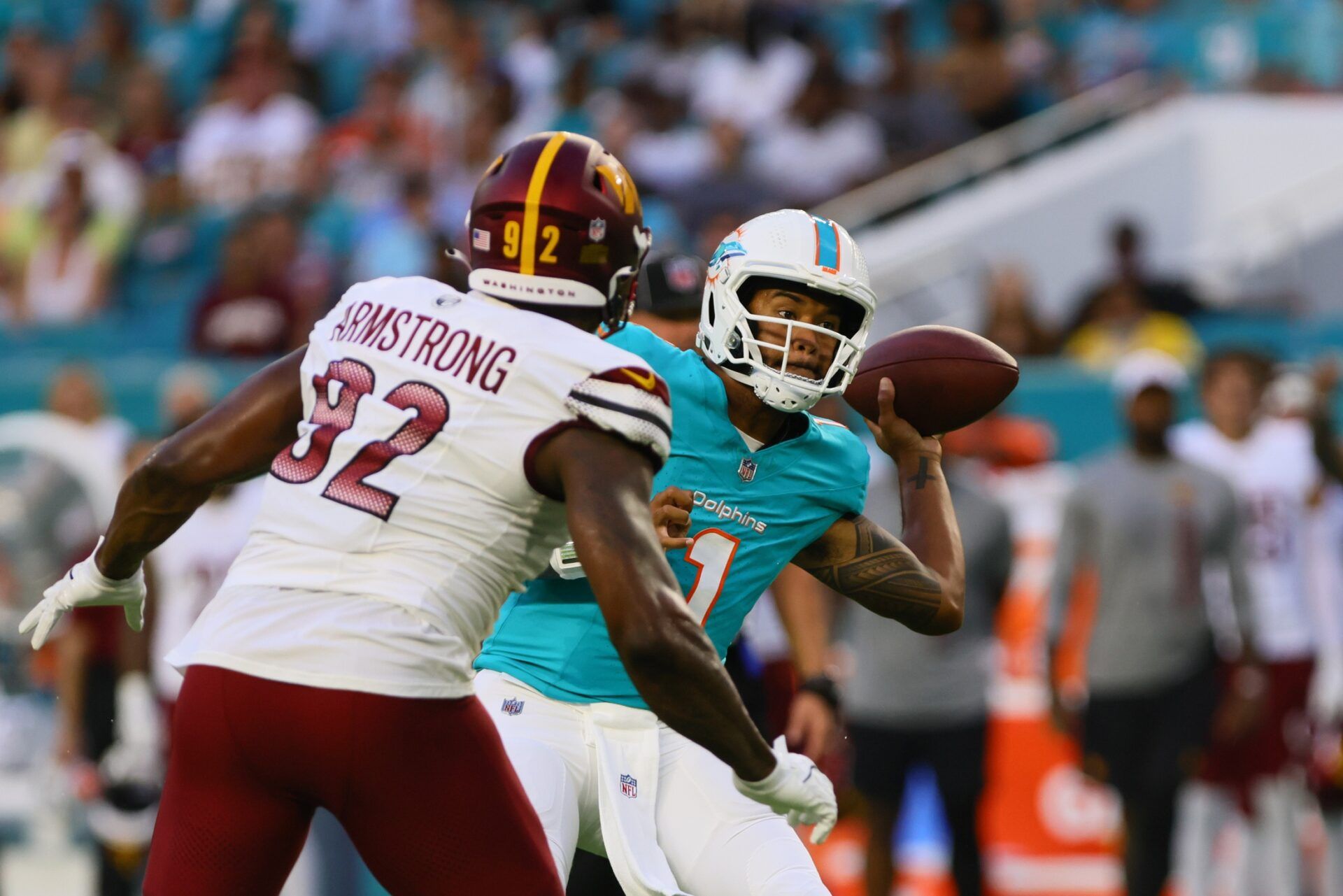 Miami Dolphins quarterback Tua Tagovailoa (1) passes the football against the Washington Commanders during the first quarter of a preseason game at Hard Rock Stadium.