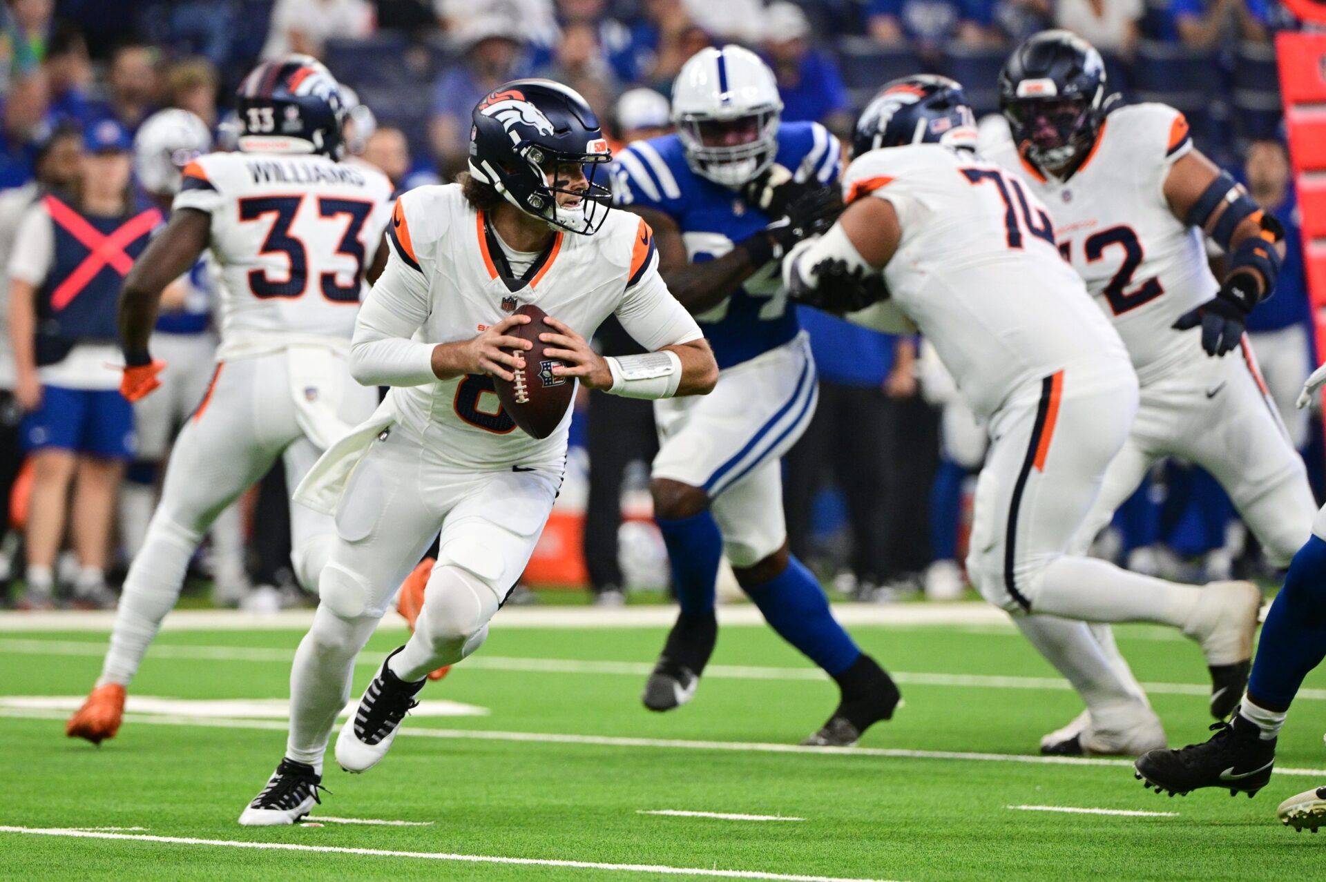 Denver Broncos quarterback Jarrett Stidham (8) prepares to throw the ball during the first quarter against the Indianapolis Colts at Lucas Oil Stadium.