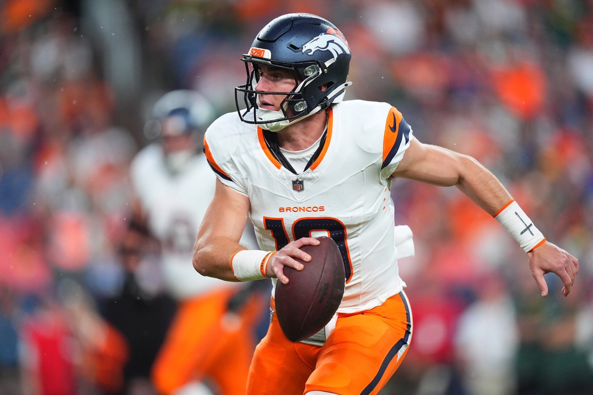 Denver Broncos quarterback Bo Nix (10) scrambles with the ball in the first quarter against the Green Bay Packers at Empower Field at Mile High. NFL survivor league