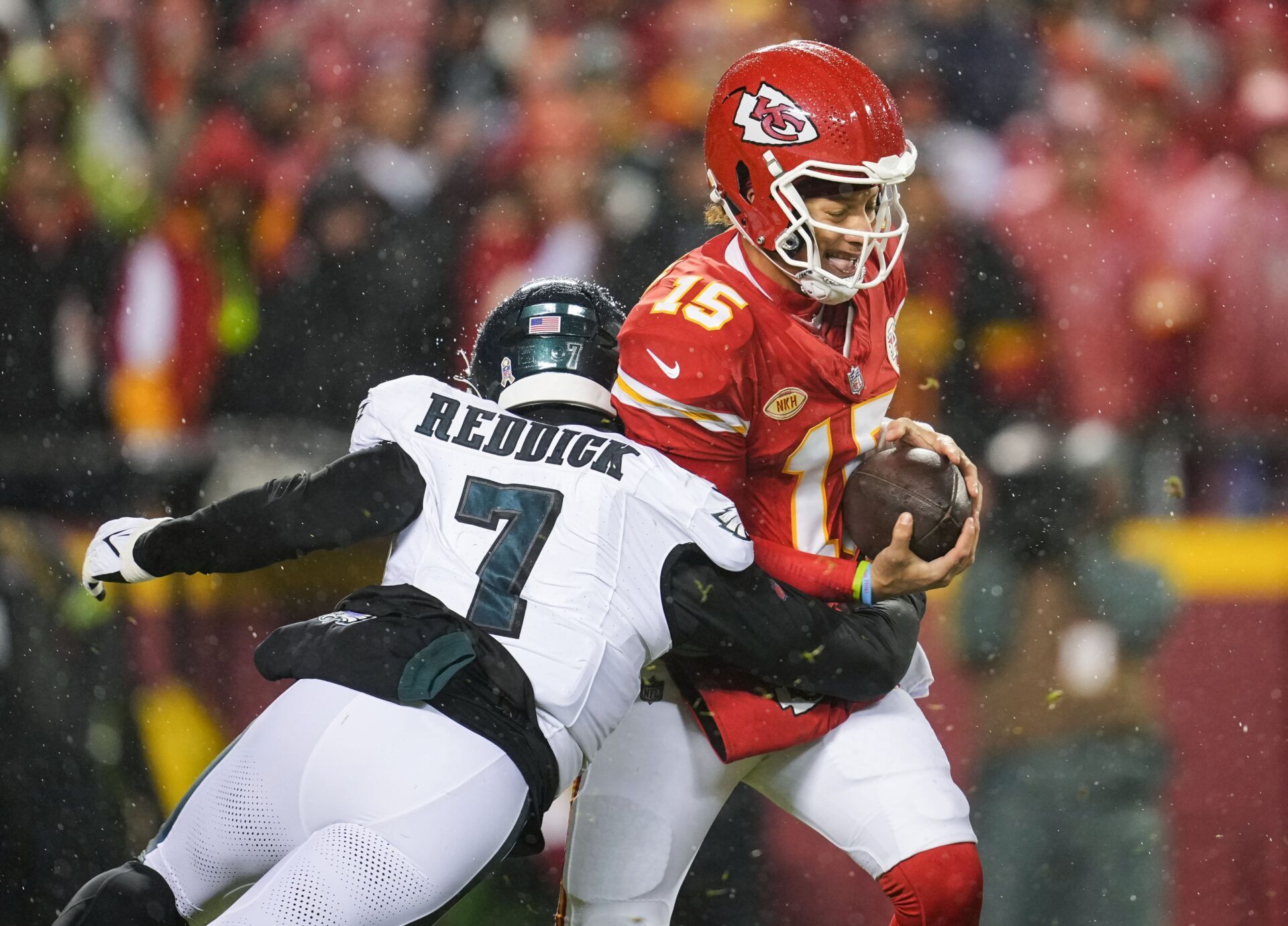 Kansas City Chiefs quarterback Patrick Mahomes (15) is sacked by Philadelphia Eagles linebacker Haason Reddick (7) during the first half at GEHA Field at Arrowhead Stadium. Mandatory Credit: Jay Biggerstaff-USA TODAY Sports