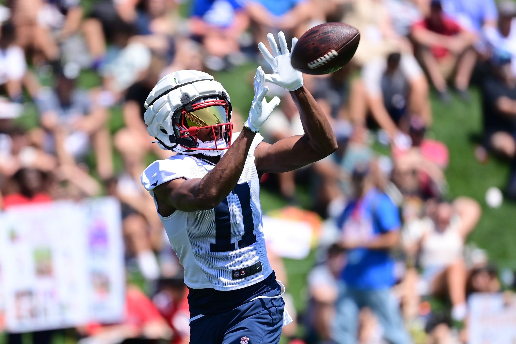 New England Patriots WR Tyquan Thornton (11) makes a catch during training camp.