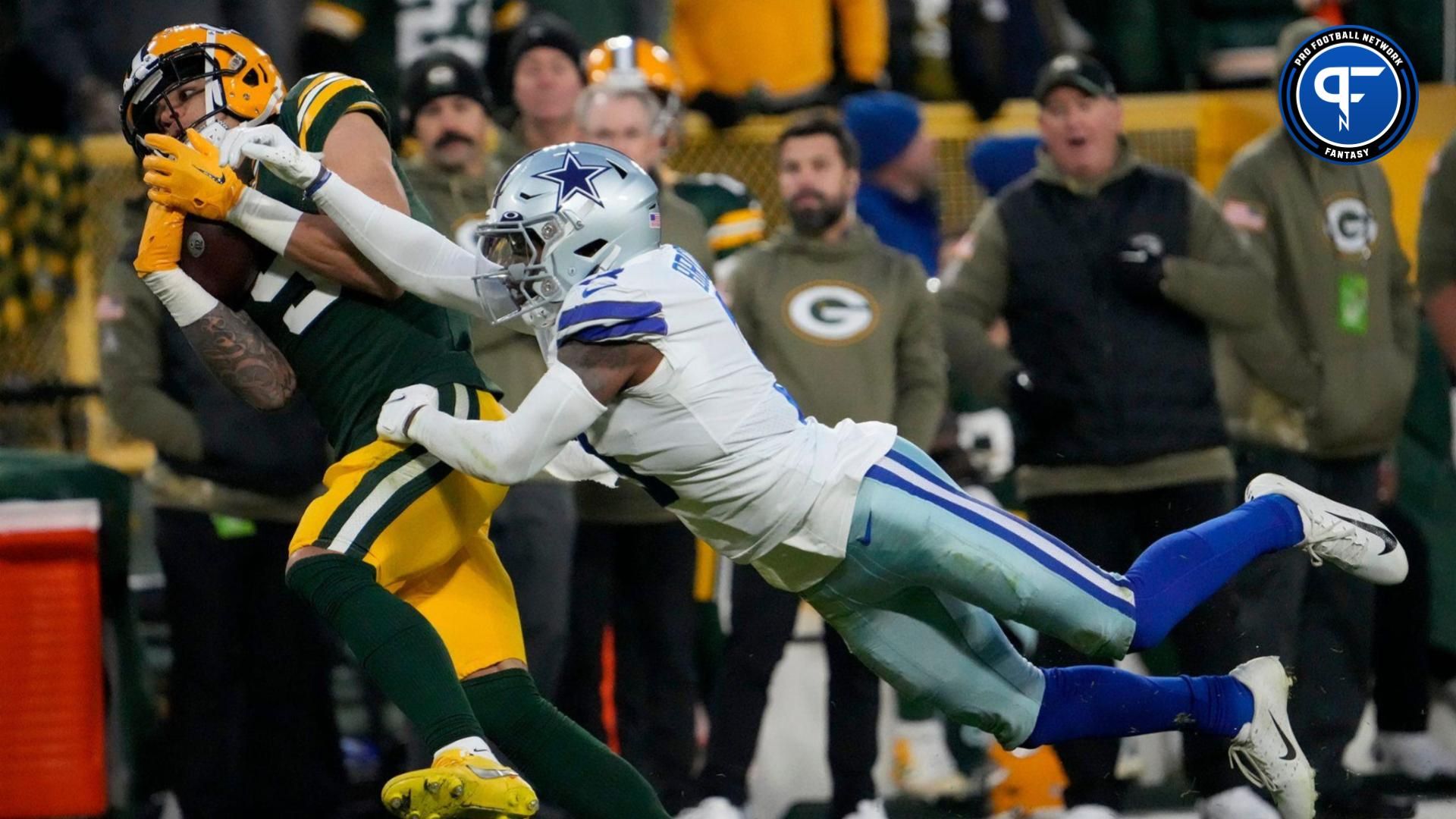 Green Bay Packers wide receiver Christian Watson (9) catches a touchdown pass as Dallas Cowboys cornerback Anthony Brown (3) defends during the first half of the Packers' 31-28 overtime win on Nov. 13, 2022 at Lambeau Field in Green Bay. © Mike De Sisti / The Milwaukee Journal Sentinel / USA TODAY NETWORK