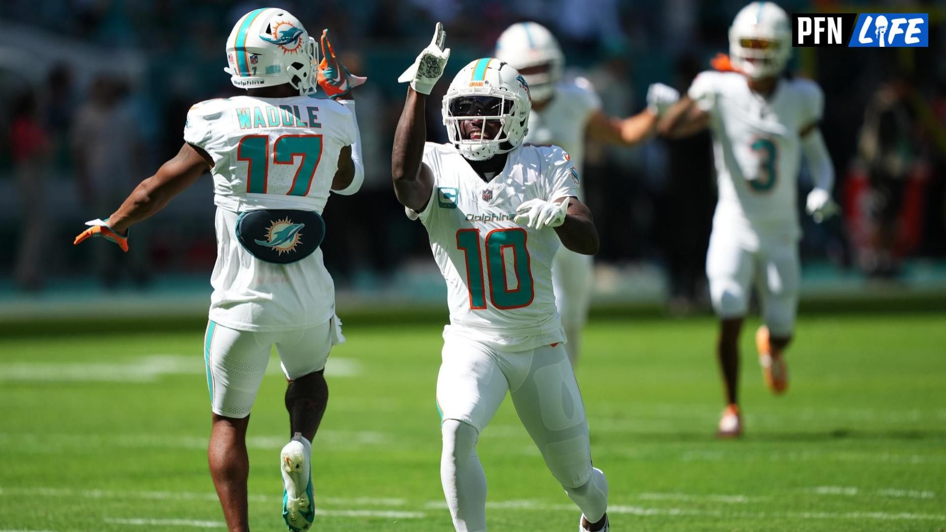 Miami Dolphins wide receiver Tyreek Hill (10) and wide receiver Jaylen Waddle (17) celebrate on the field prior to the game against the Carolina Panthers at Hard Rock Stadium. Mandatory Credit: Jasen Vinlove-USA TODAY Sports