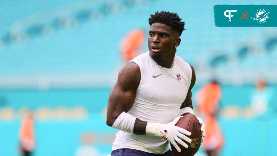 Miami Dolphins wide receiver Tyreek Hill (10) throws the football before preseason game against the Washington Commanders at Hard Rock Stadium.