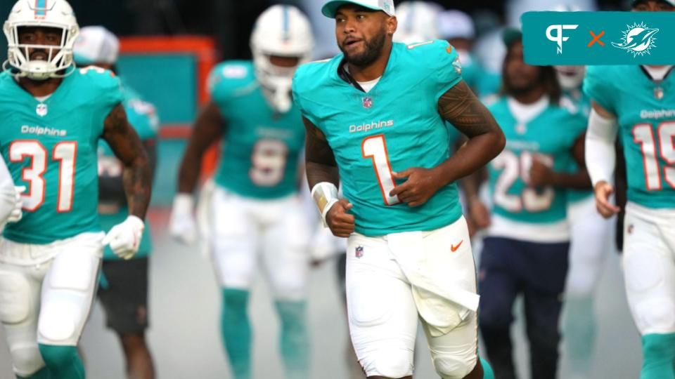 Miami Dolphins quarterback Tua Tagovailoa (1) takes to the field before the game against the Washington Commanders at Hard Rock Stadium.