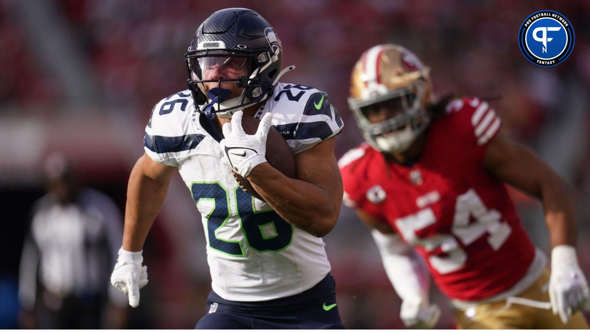 Seattle Seahawks running back Zach Charbonnet (26) runs past San Francisco 49ers linebacker Fred Warner (54) in the first quarter at Levi's Stadium. Mandatory Credit: Cary Edmondson-USA TODAY Sports