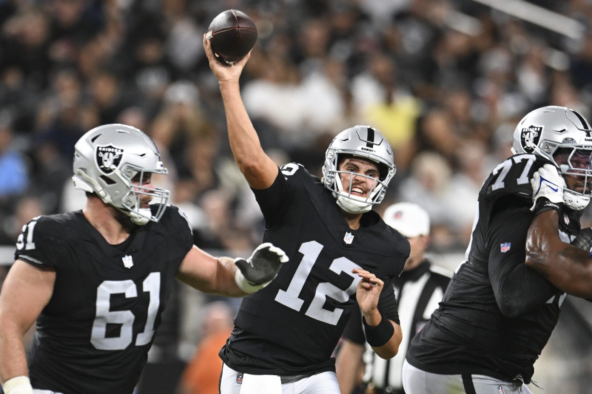 Aug 17, 2024; Paradise, Nevada, USA; Las Vegas Raiders quarterback Aidan O'Connell (12) throws the ball against the Dallas Cowboys in the third quarter at Allegiant Stadium. Mandatory Credit: Candice Ward-USA TODAY Sports